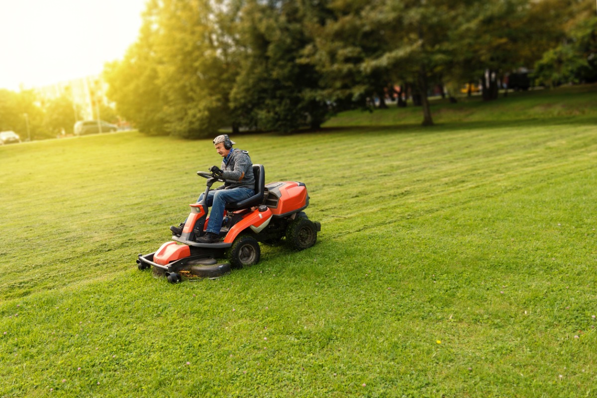 Front Page -Garden - Landscaping Store man drives a lawnmower picture id1094100388